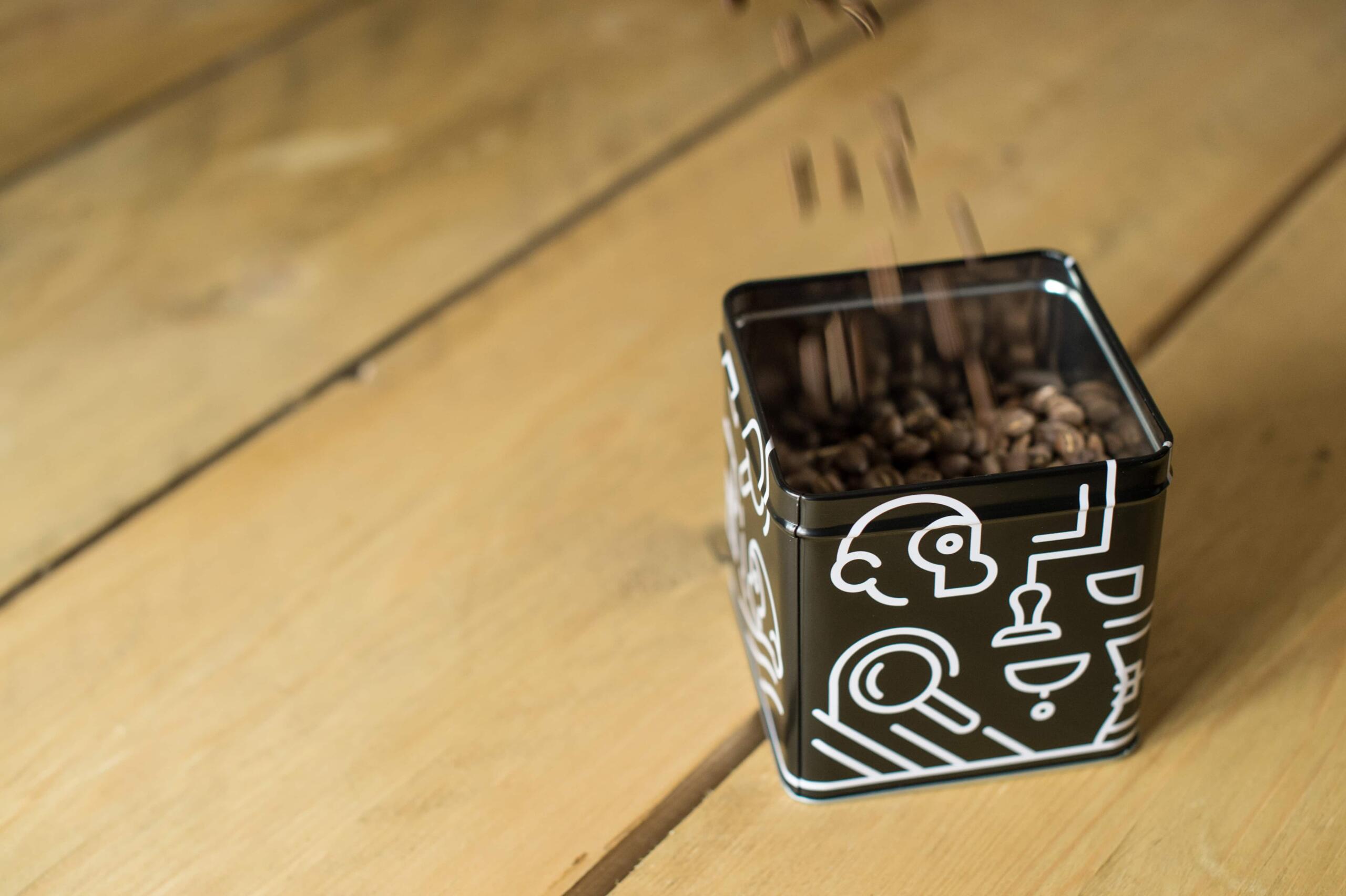 A coffee tin being filled up with, ordered using a coffee subscrption