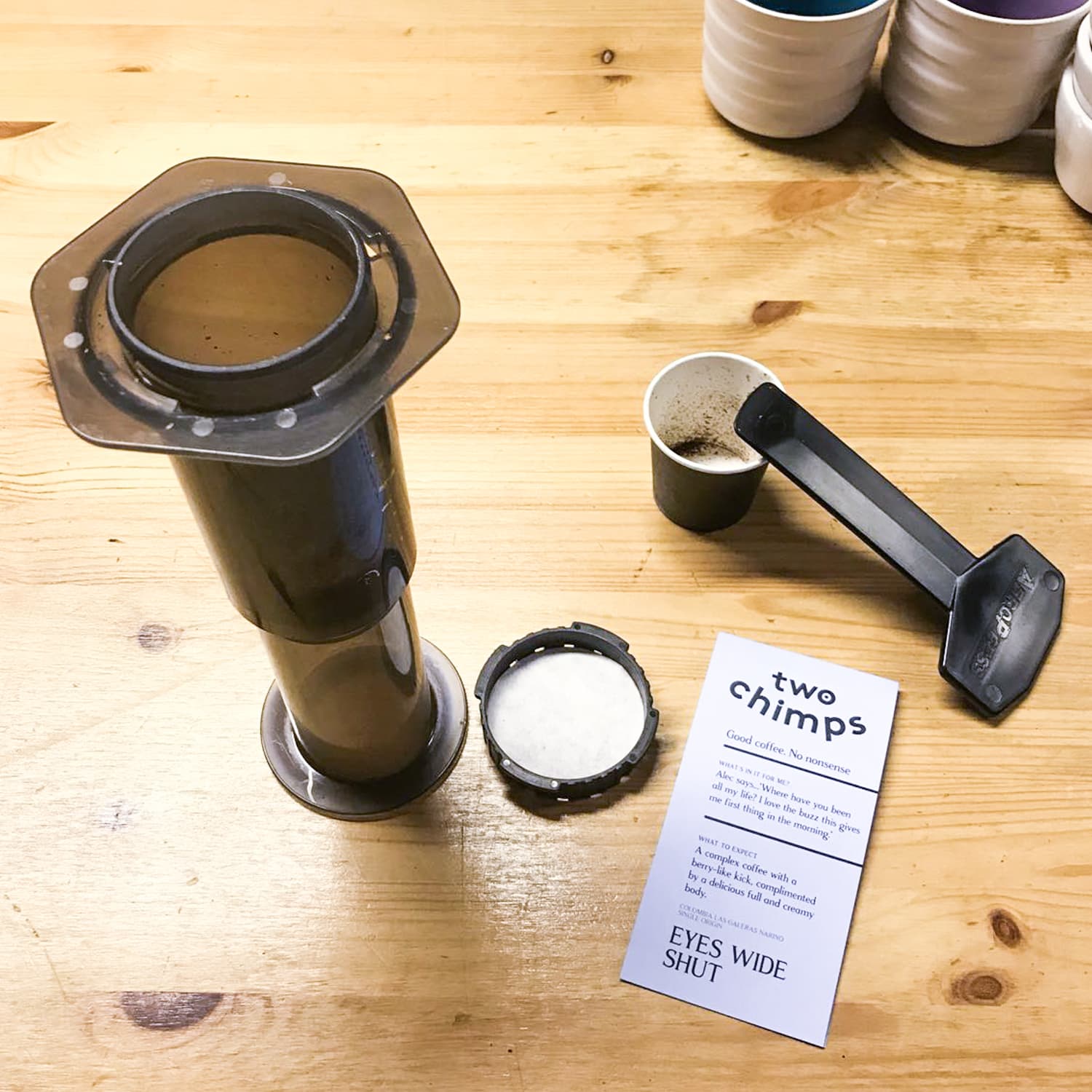 aeropress, stirrer and two chimps coffee label