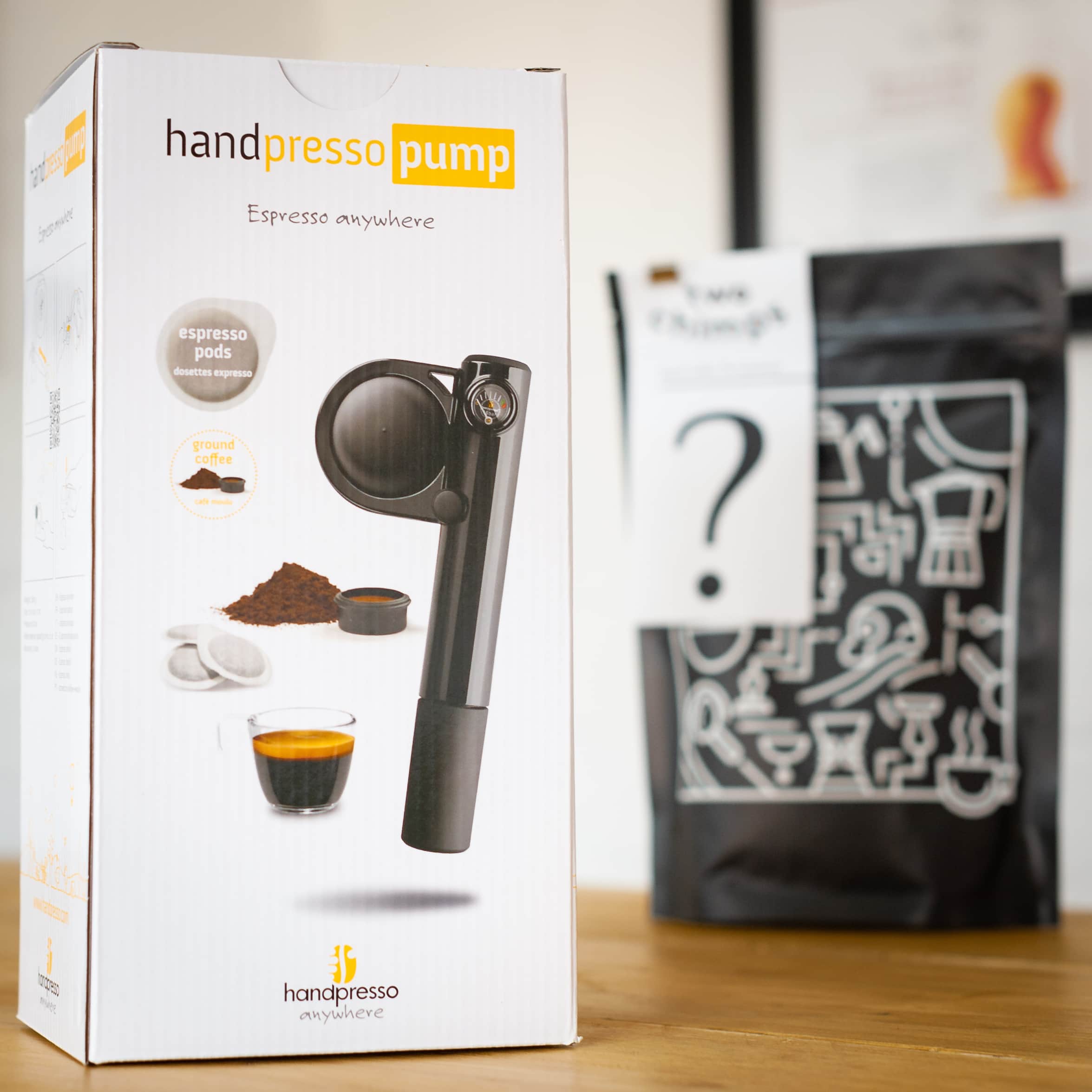 handpresso in box and bag of two chimps coffee