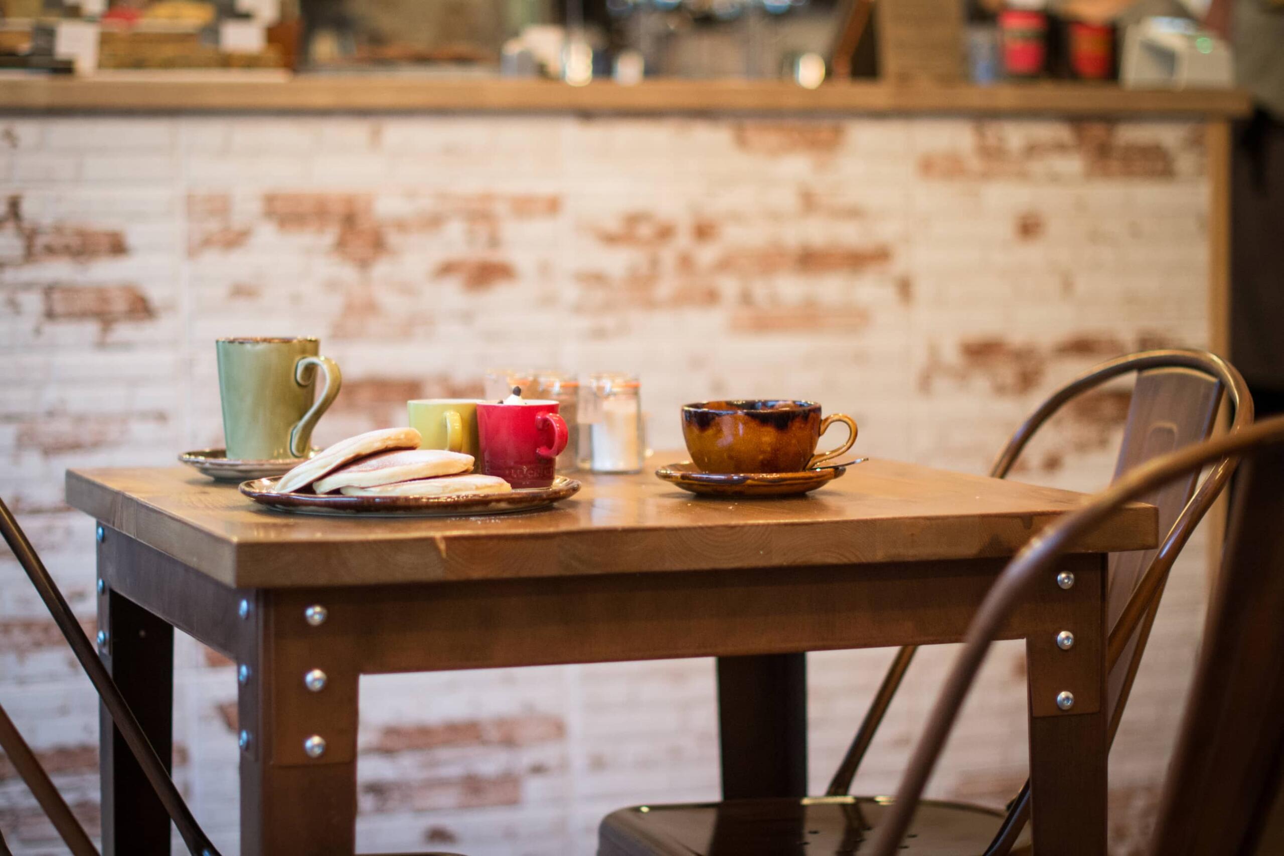 pancakes and two chimps coffee set out on a table at The Larder Coffee Shop in Oakham