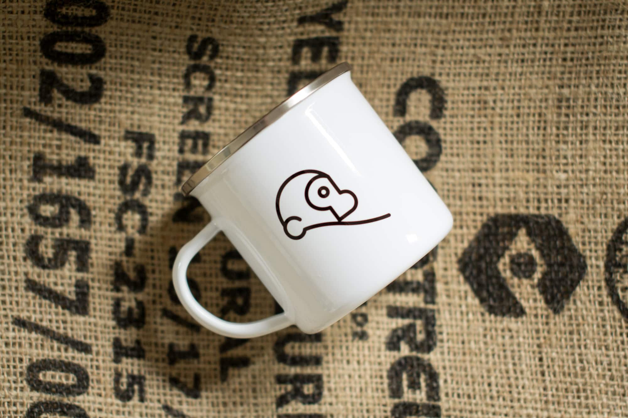 Two Chimps enamel mug on coffee sack