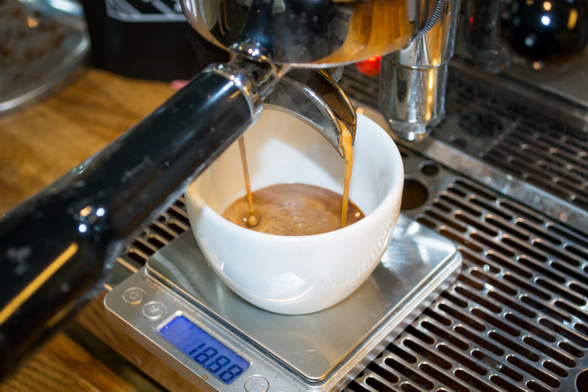 espresso pouring into a cup