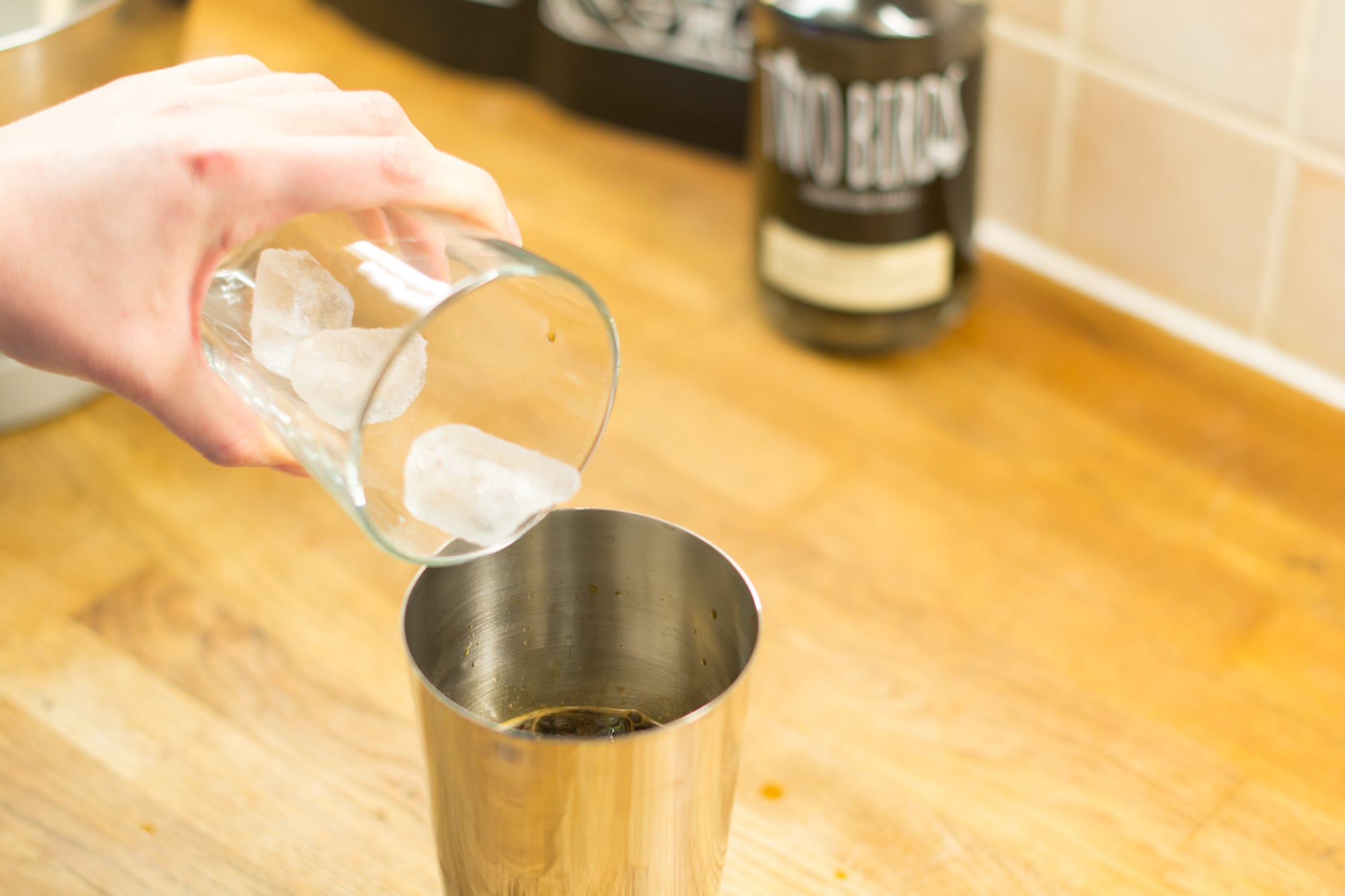 Adding some ice to the cocktail shaker