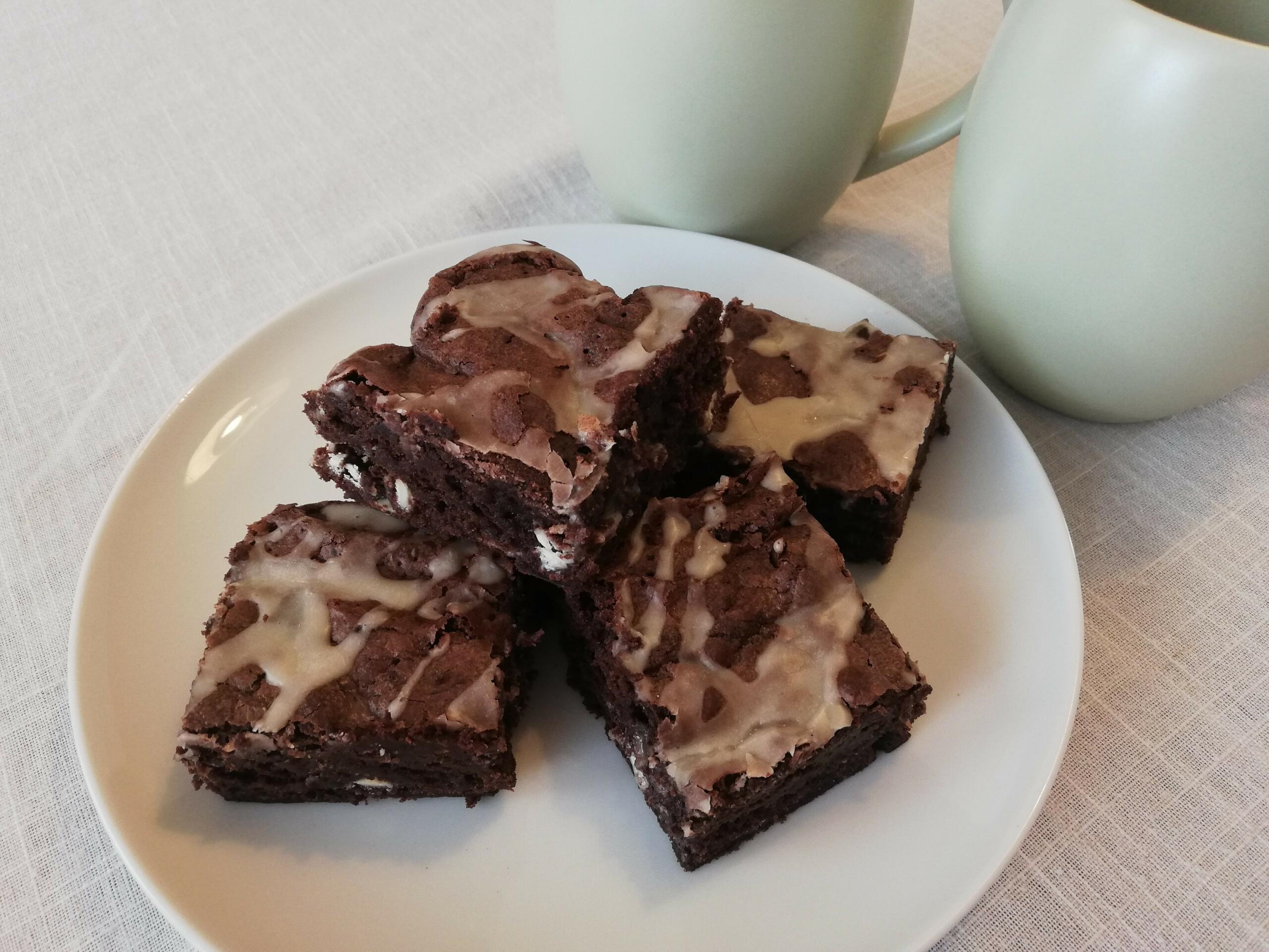 Stack of coffee brownies in white plate