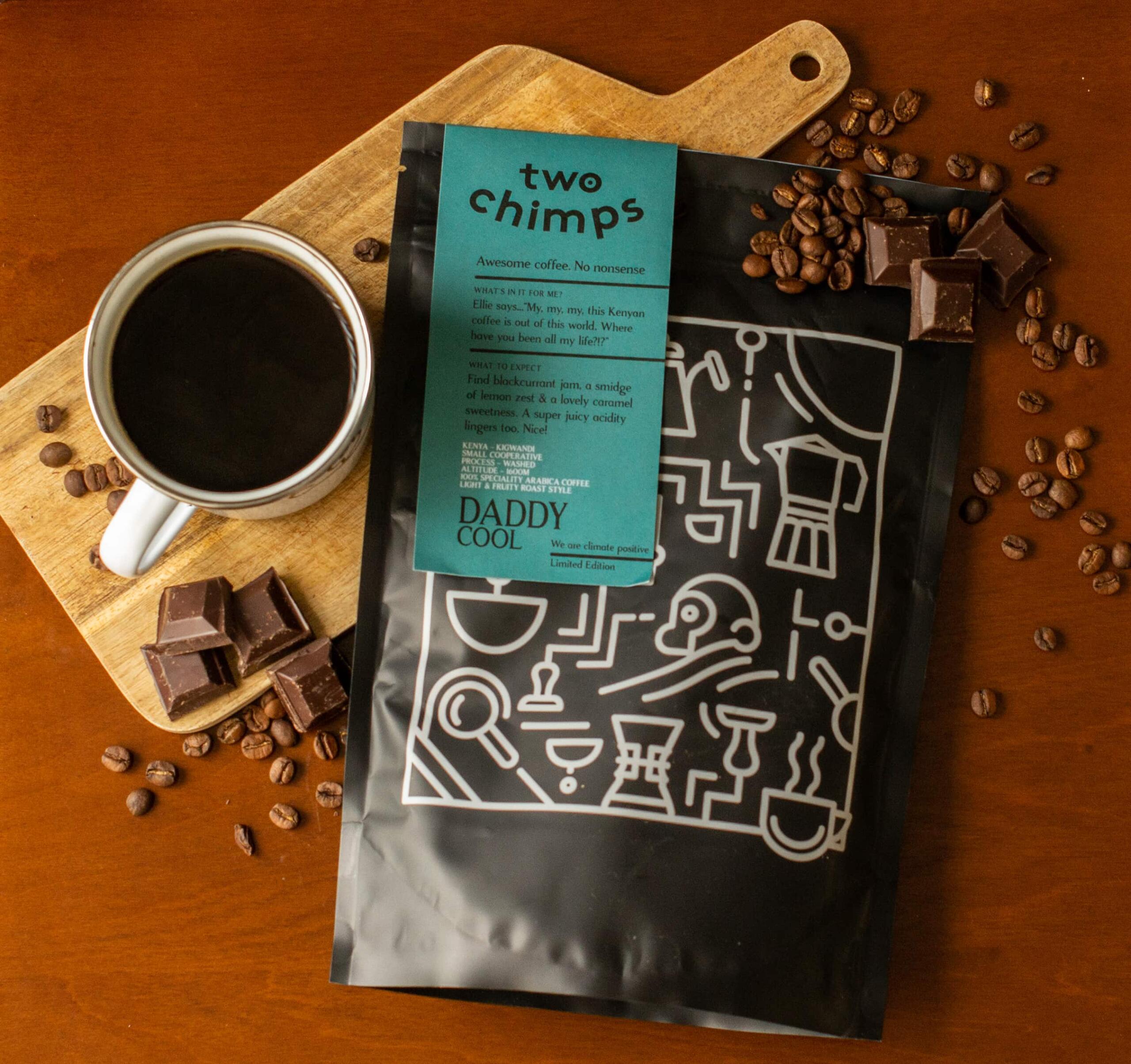 Bag of Kenyan coffee with coffee beans, mug and dark chocolate