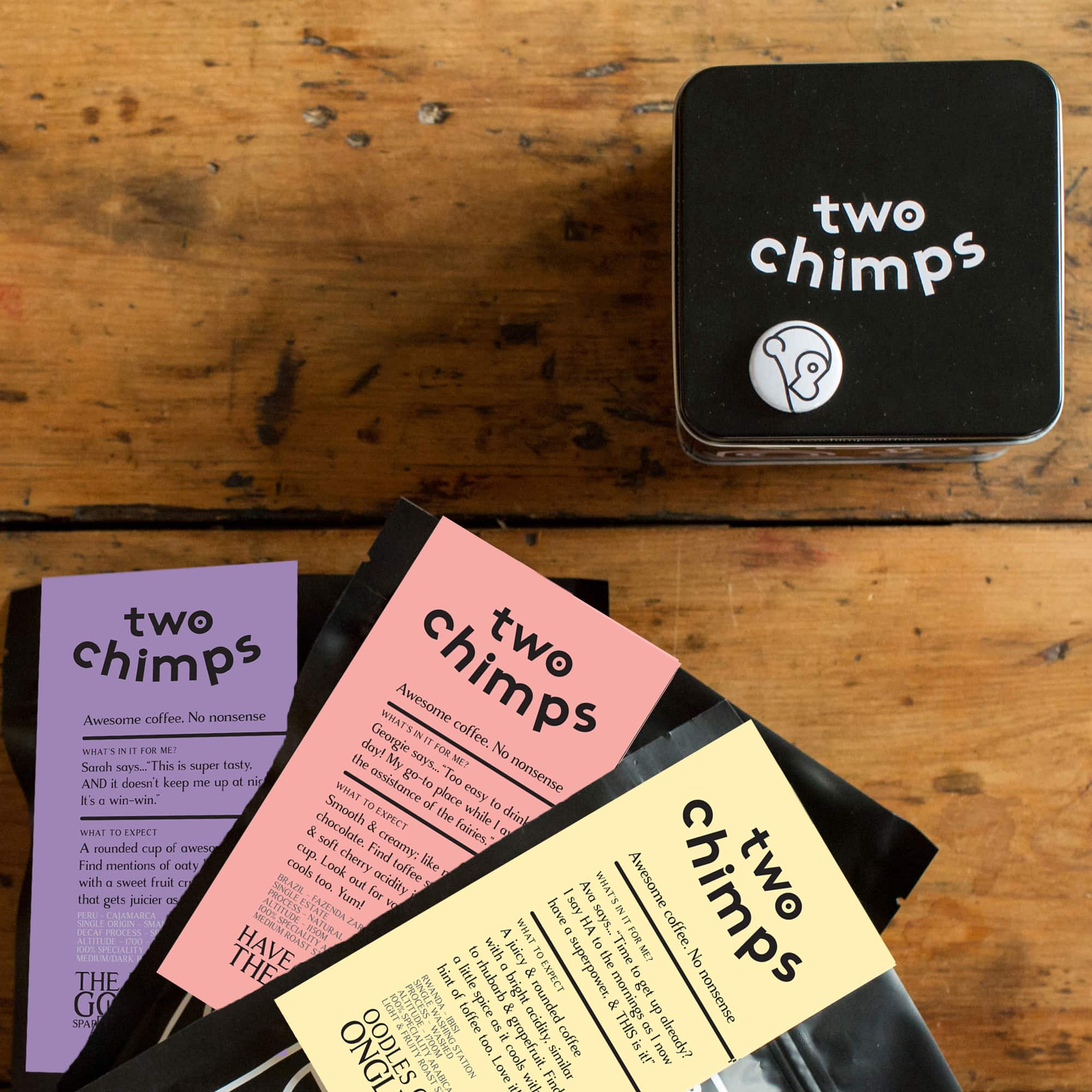 set of three coffees on the table with tin - two chimps coffee