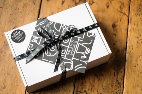 White Two Chimps gift box tied with black ribbon fixed with gift note 