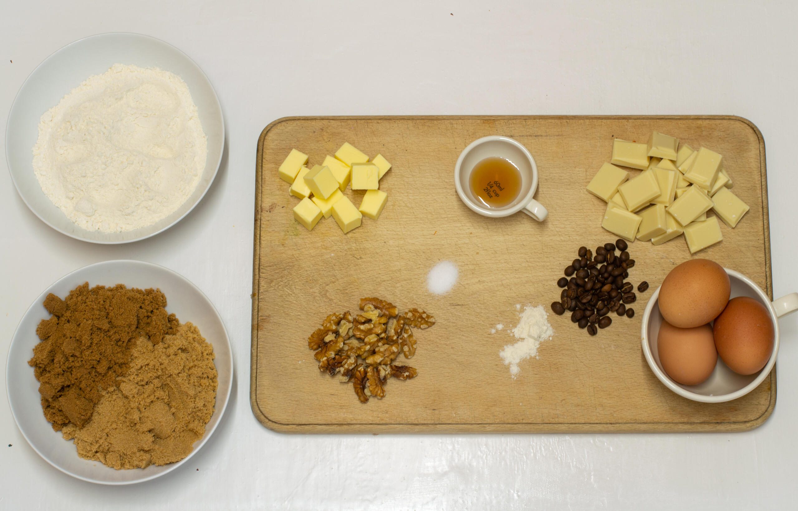 Ingredients for coffee blondies laid out on a chopping board