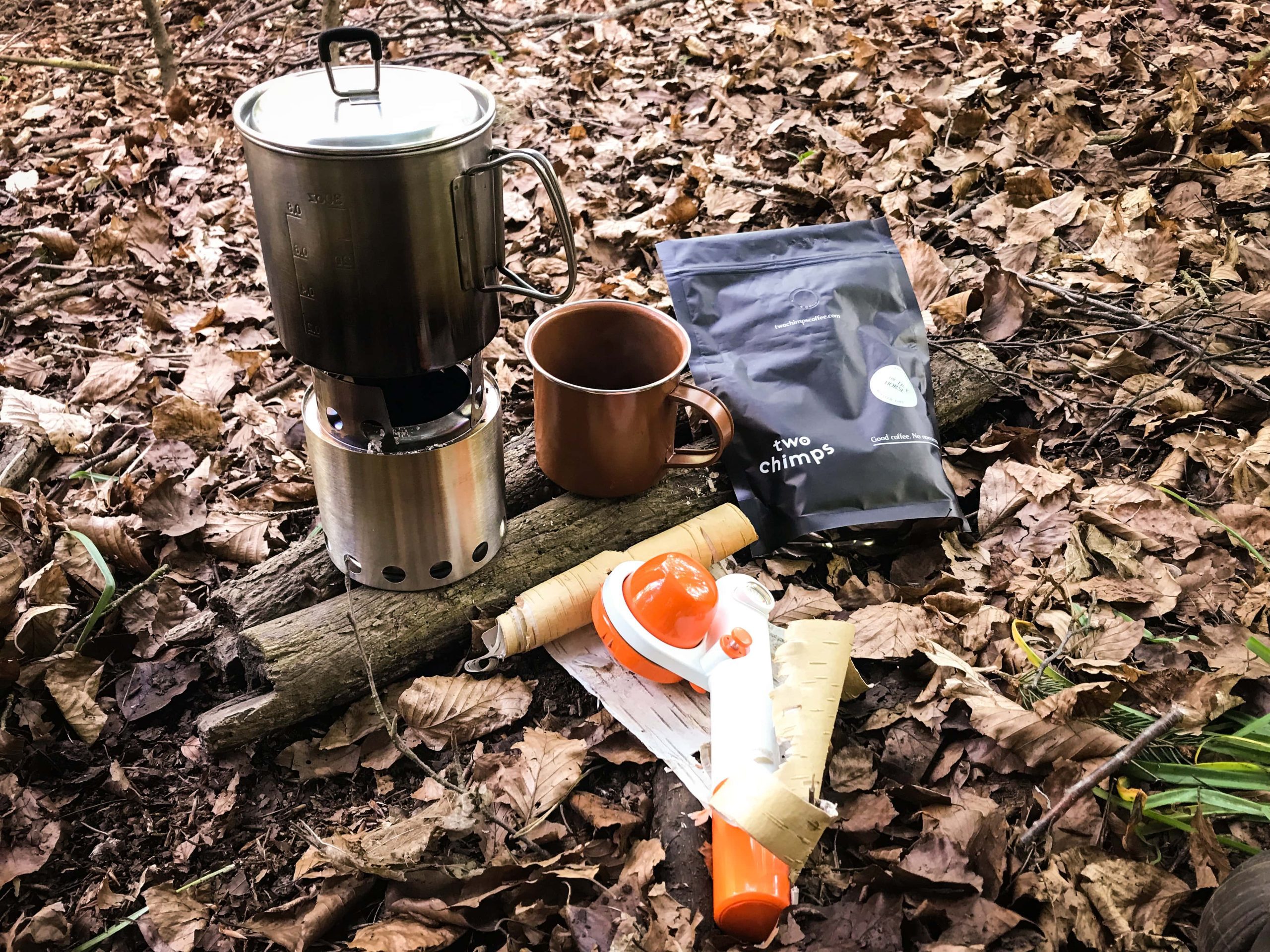 handpresso pump, stove and two chimps coffee in the woods