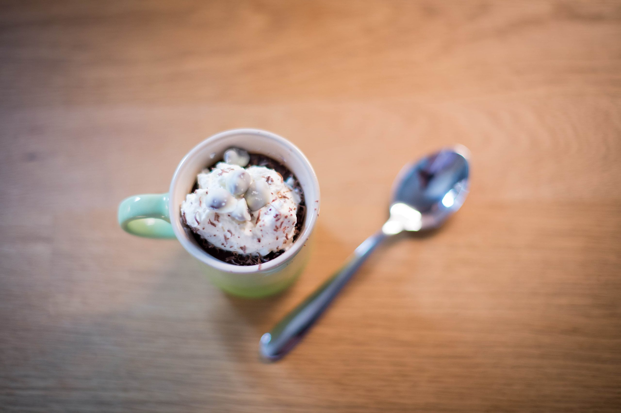A Coffee and Chocolate dessert with a spoon