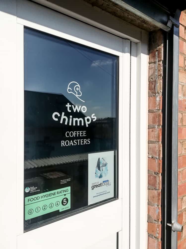 Two Chimps Window Sticker on a door