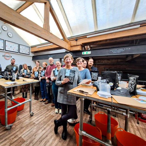Guests at the create your own coffee blend course with their custom blends to take home
