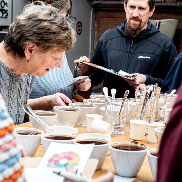 Guests at the create your own coffee blend course making notes