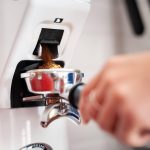 coffee grinding into portafilter