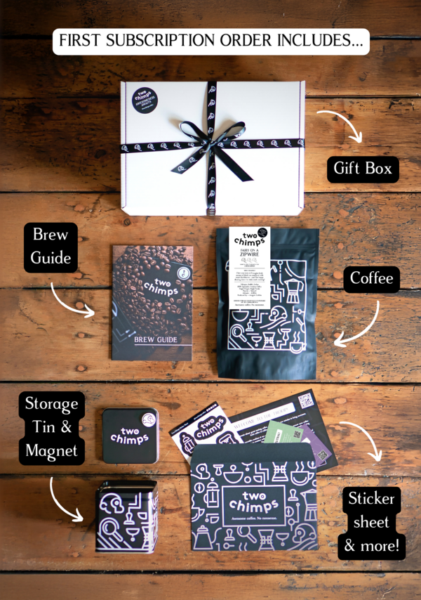 An image of the components of a Two Chimps specialty coffee subscription including light and fruity roasted coffee, tin and magnet and gift box