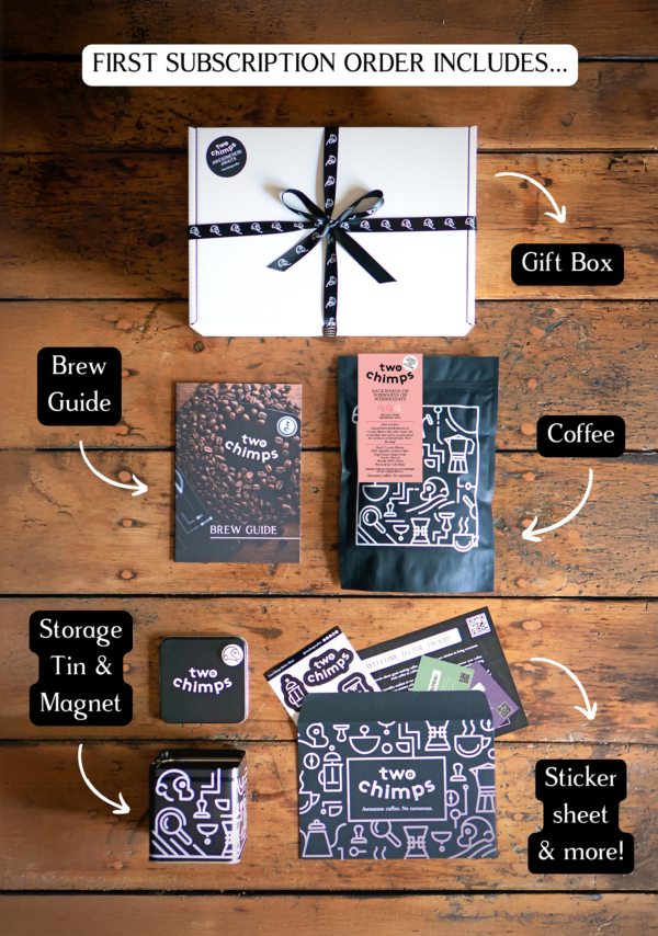 An image of the components of a Two Chimps specialty coffee subscription including medium roasted coffee, tin and magnet and gift box