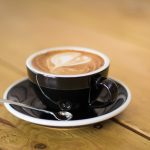 cup of two chimps coffee on a saucer