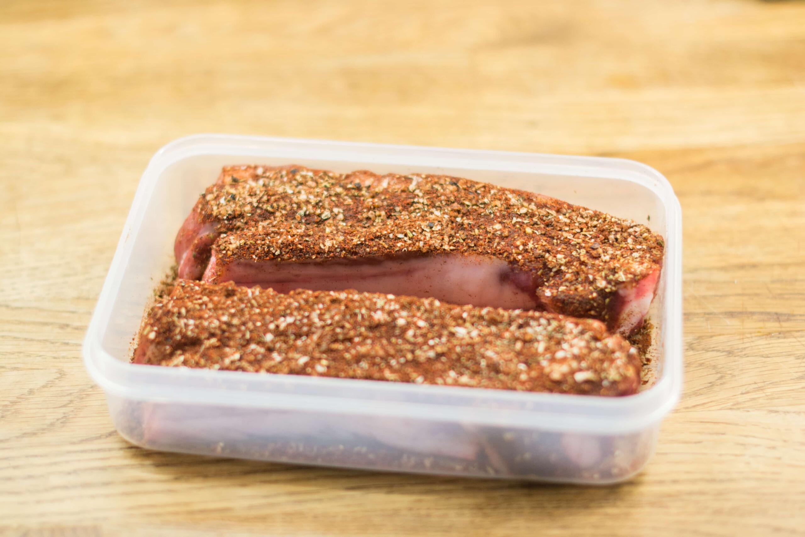 pork belly in a plastic tub