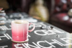 Pink coffee mug on table