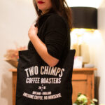 girl holding a tote bag on her shoulder