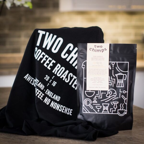 two chimps t-shirt with bag of coffee on a kitchen worktop