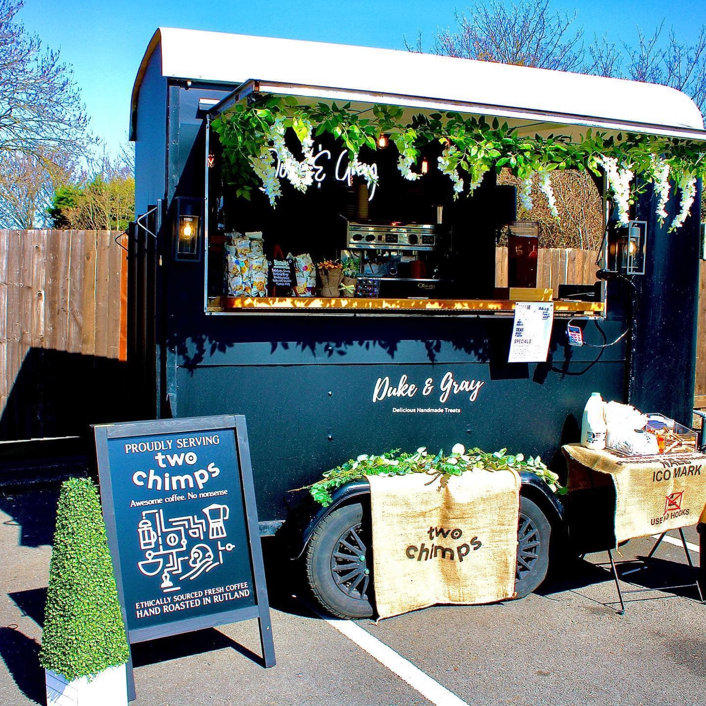 Duke & Gray trailer with Two Chimps a board