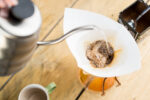 Pouring water into chemex coffee device