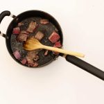 Overhead shot of lamb browning in saucepan