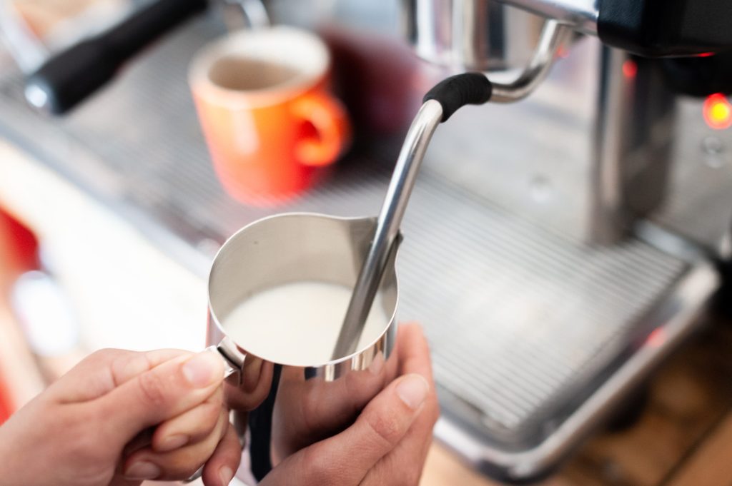 steaming milk on an espresso machine