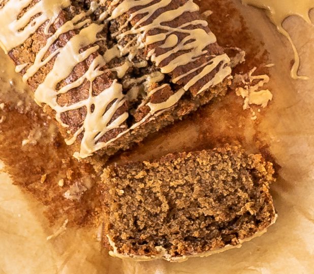 Slice of coffee loaf cake on brown paper