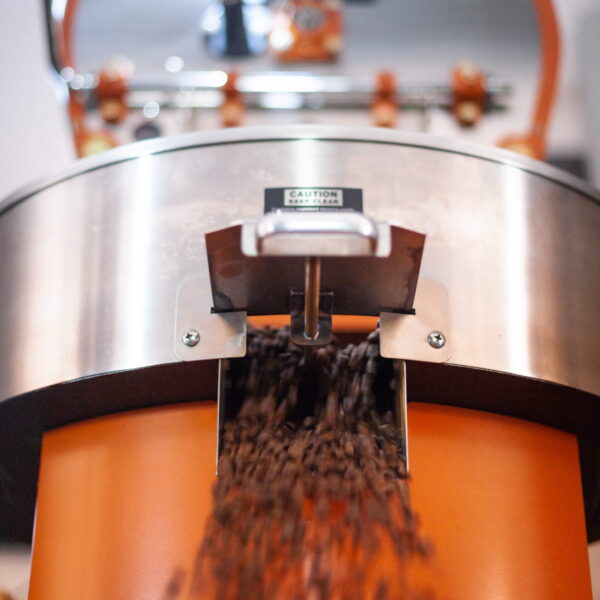Roasted coffee coming out of the roaster