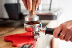 Tamping coffee in portafilter
